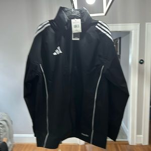 Adidas Tiro 2024 Rain Jacket black with white stripes.